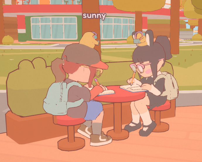 Two players co-working in the game On Together. Their low-poly avatars sit at a round table writing.